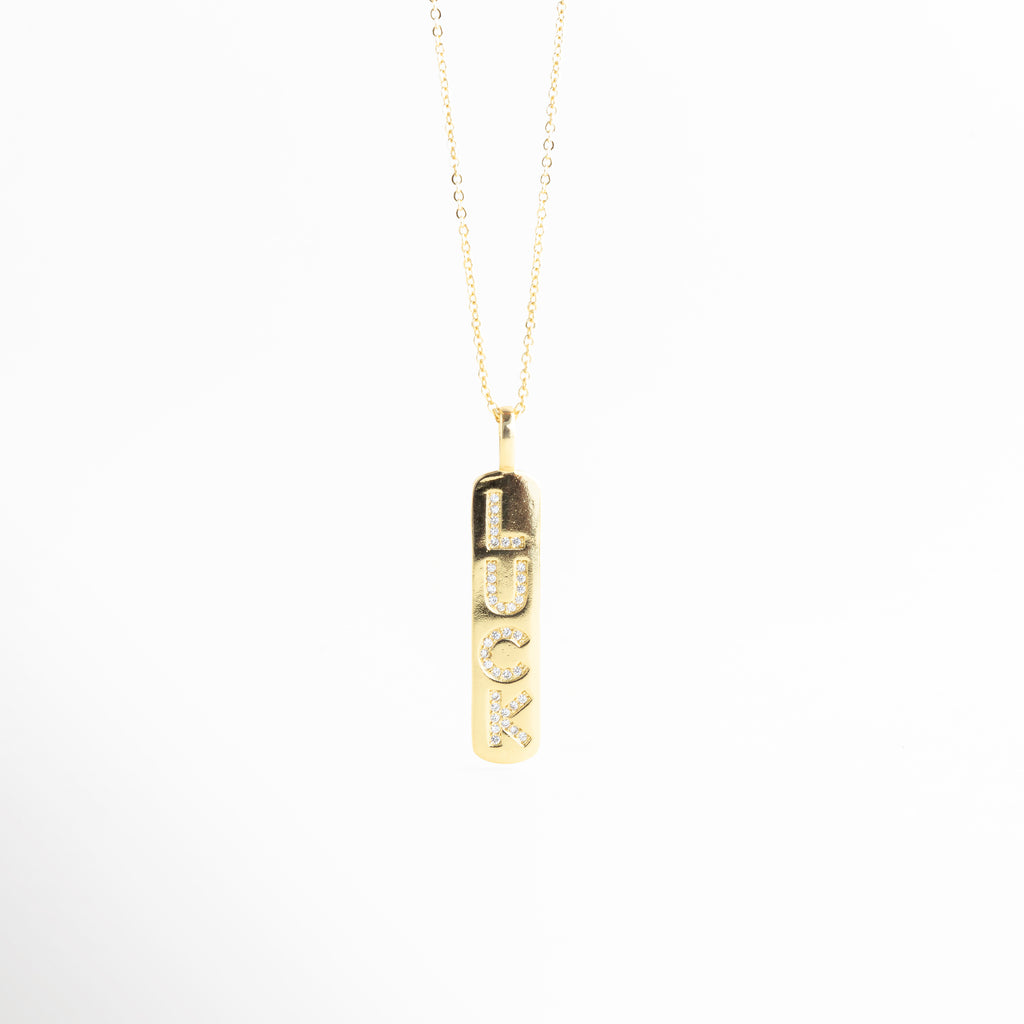 Collar dorado con dije vertical rectangular con zirconias brillantes, Collar minimalista barra dorada con incrustaciones de zirconia, Collar elegante chapado en oro con colgante largo de zirconias, Gargantilla fina con dije vertical dorado brillante con zirconias, Collar de cobre chapado en oro con colgante rectangular 4.3 cm