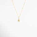 Collar dorado con dije de niña y zirconia amarilla brillante, Collar delicado con colgante femenino y piedra amarilla elegante, Collar en oro 18K con dije de niña y zirconia amarilla, Collar fino dorado con figura de niña y detalle amarillo, Collar femenino con colgante pequeño y zirconia amarilla