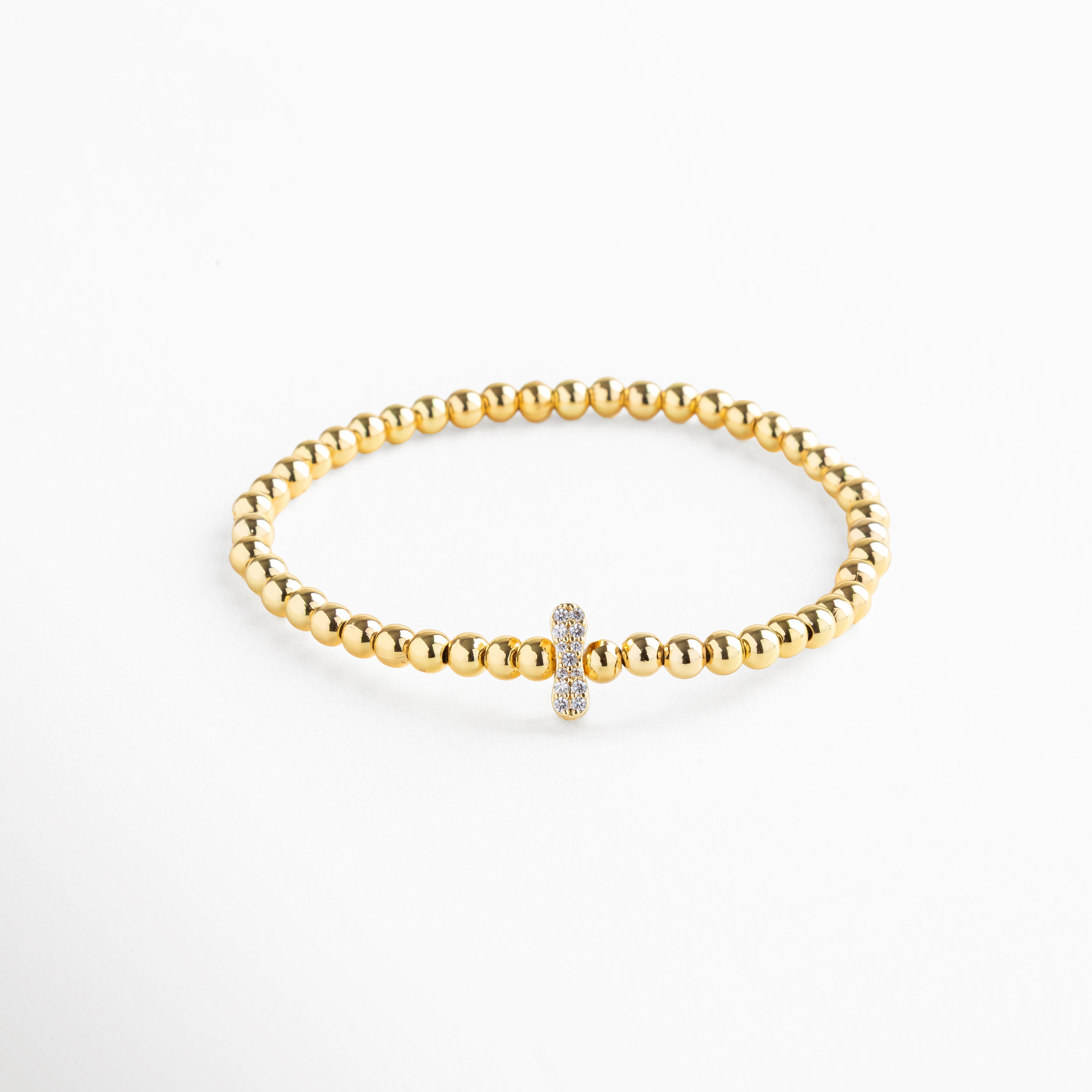 Pulsera elástica de cobre con recubrimiento enchapado en oro 18K e incrustaciones de zirconias, diseño de cuentas doradas con dije en forma de letra I personalizada, joya delicada y versátil de 1 x 0.7 cm ideal para uso diario.