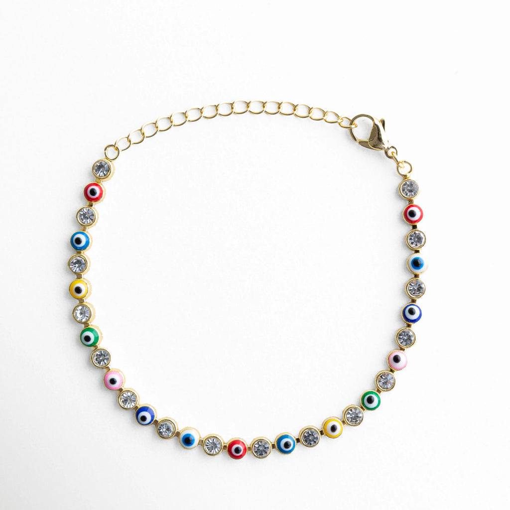 Pulsera ojitos multicolor dorada con piedras brillantes y diseño de ojo turco, Pulsera de ojos turcos de colores con acabado dorado y estilo elegante, Pulsera fina dorada con ojitos multicolor y piedras brillantes mujer, Pulsera ojitos colores con diseño vibrante y acabado en oro 18K, Pulsera de protección con ojos turcos multicolor y detalles brillantes