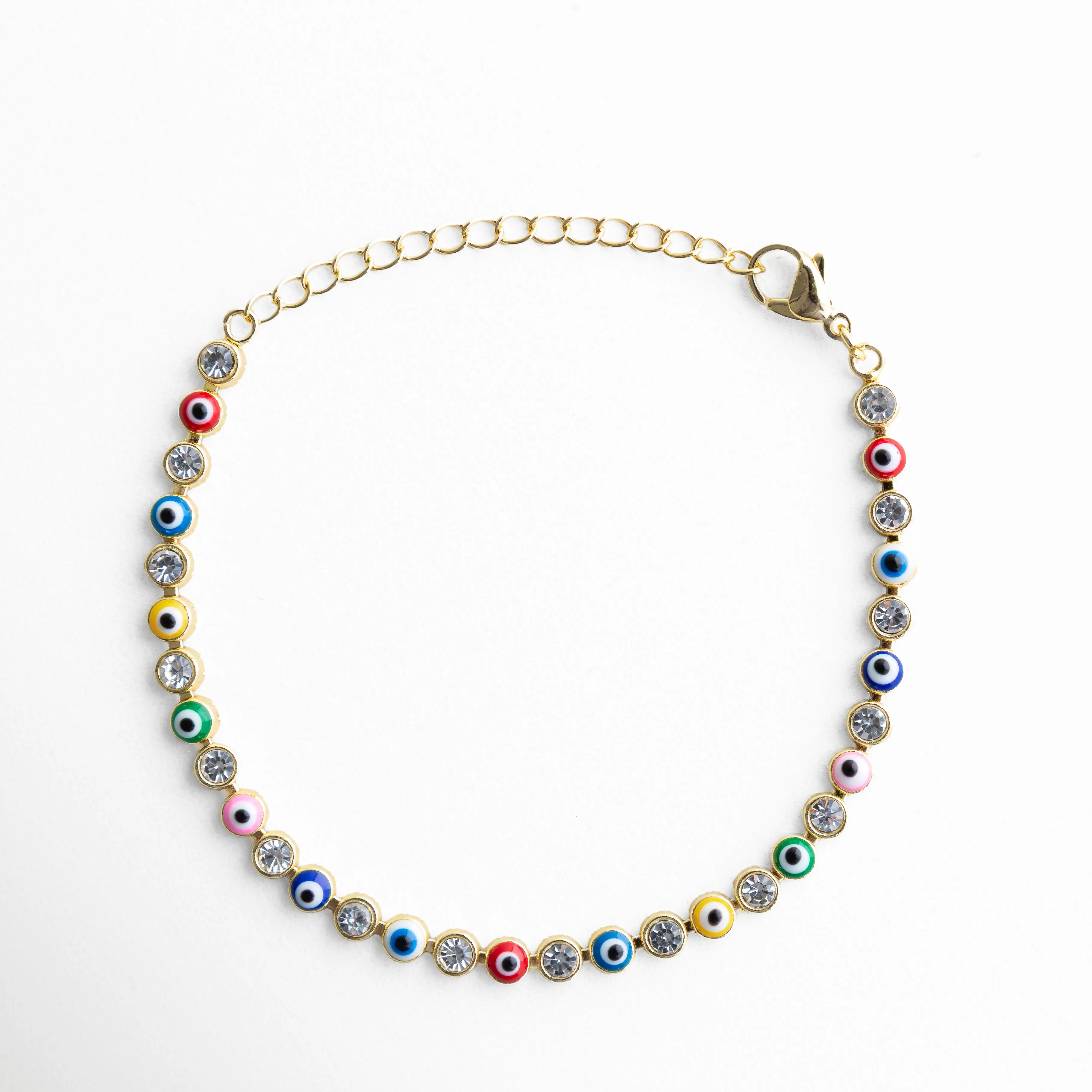Pulsera ojitos multicolor dorada con piedras brillantes y diseño de ojo turco, Pulsera de ojos turcos de colores con acabado dorado y estilo elegante, Pulsera fina dorada con ojitos multicolor y piedras brillantes mujer, Pulsera ojitos colores con diseño vibrante y acabado en oro 18K, Pulsera de protección con ojos turcos multicolor y detalles brillantes