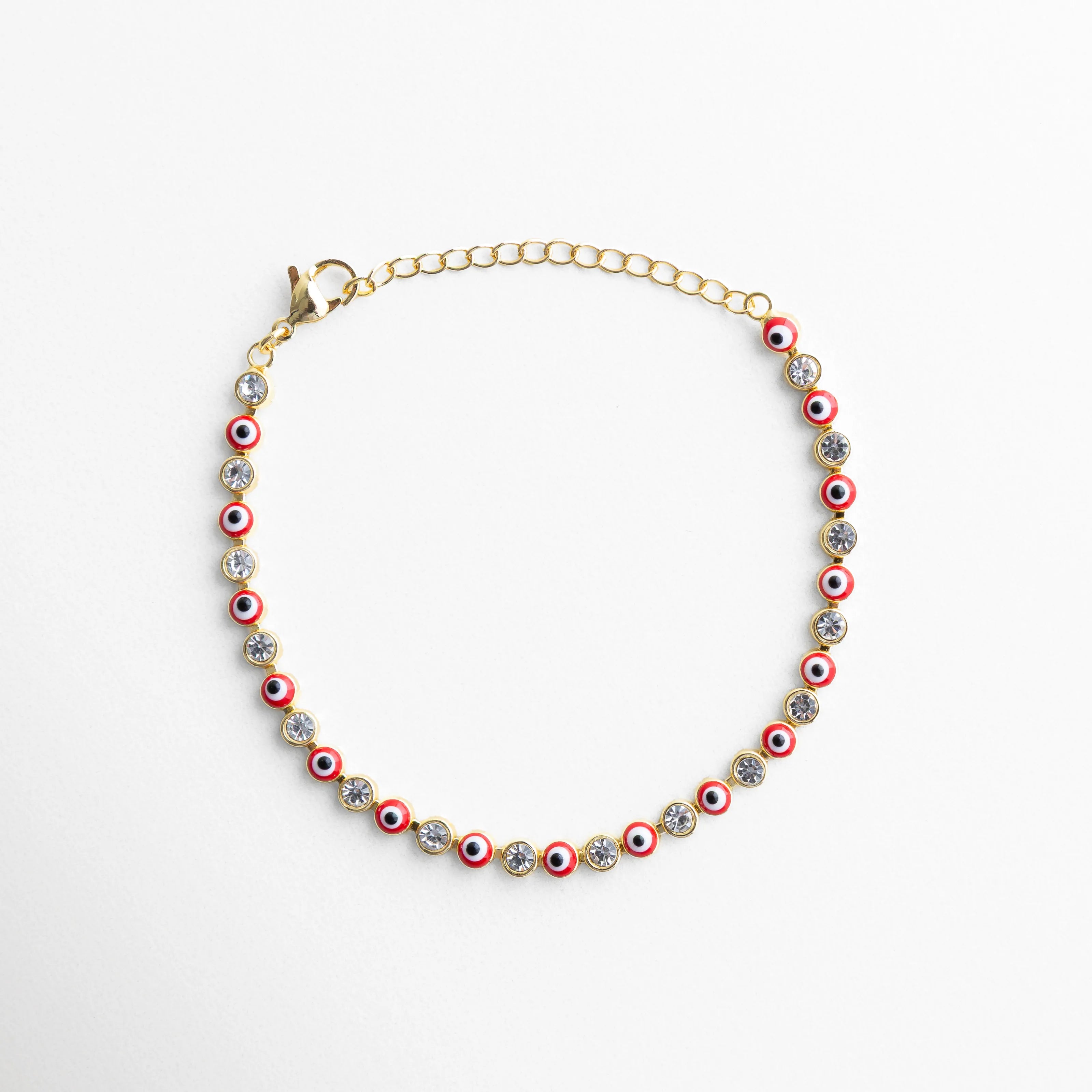 Pulsera ojitos rojos dorada con piedras brillantes y diseño de ojo turco, Pulsera de ojos turcos rojos con acabado dorado y estilo elegante, Pulsera fina dorada con ojitos rojos y piedras brillantes mujer, Pulsera ojitos roja con diseño vibrante y acabado en oro 18K, Pulsera de protección con ojos turcos rojos y detalles brillantes
