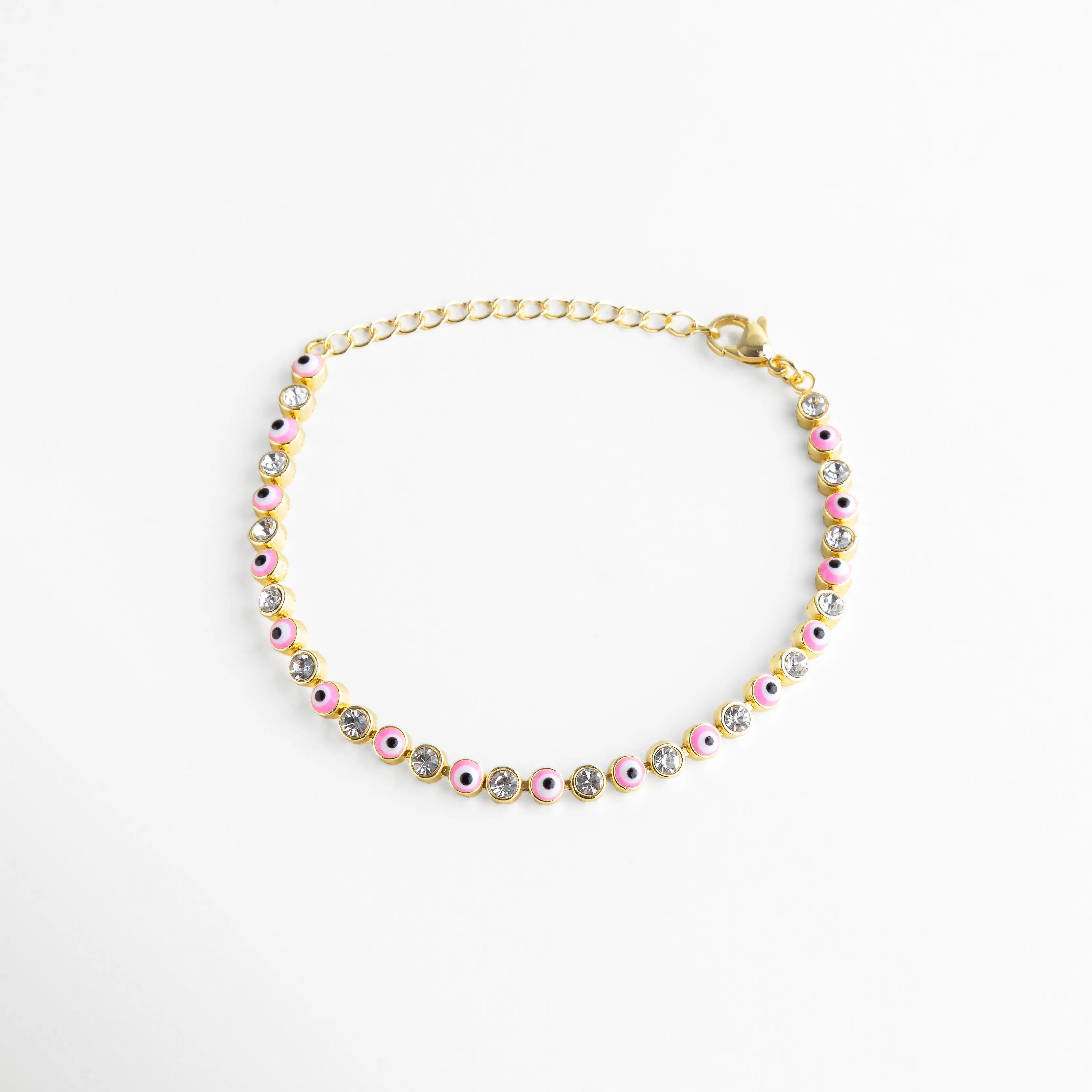 Pulsera ajustable de ojitos rosas con cristales incrustados, ideal para usar sola o combinar con otras piezas.