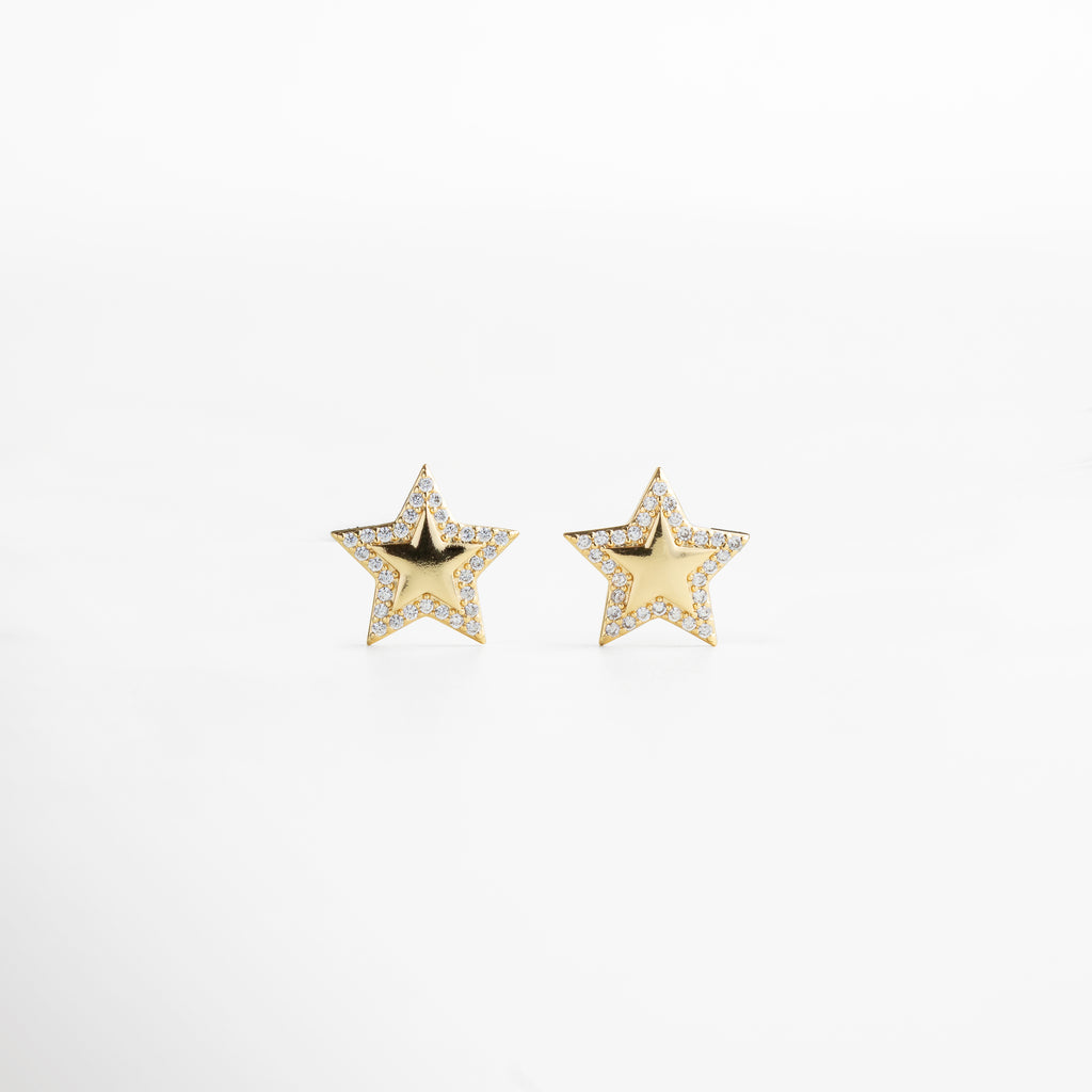 aretes dorados en forma de estrella, diseño llamativo y encantador, incrustaciones de zirconias que reflejan la luz, joyería elegante para ocasiones especiales, accesorio femenino que eleva cualquier outfit
