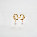 perla colgante, perla barroca, joya femenina, atemporal, elegancia moderna, aretes atemporales, aretes de acero inoxidable, aretes con perla barroca 