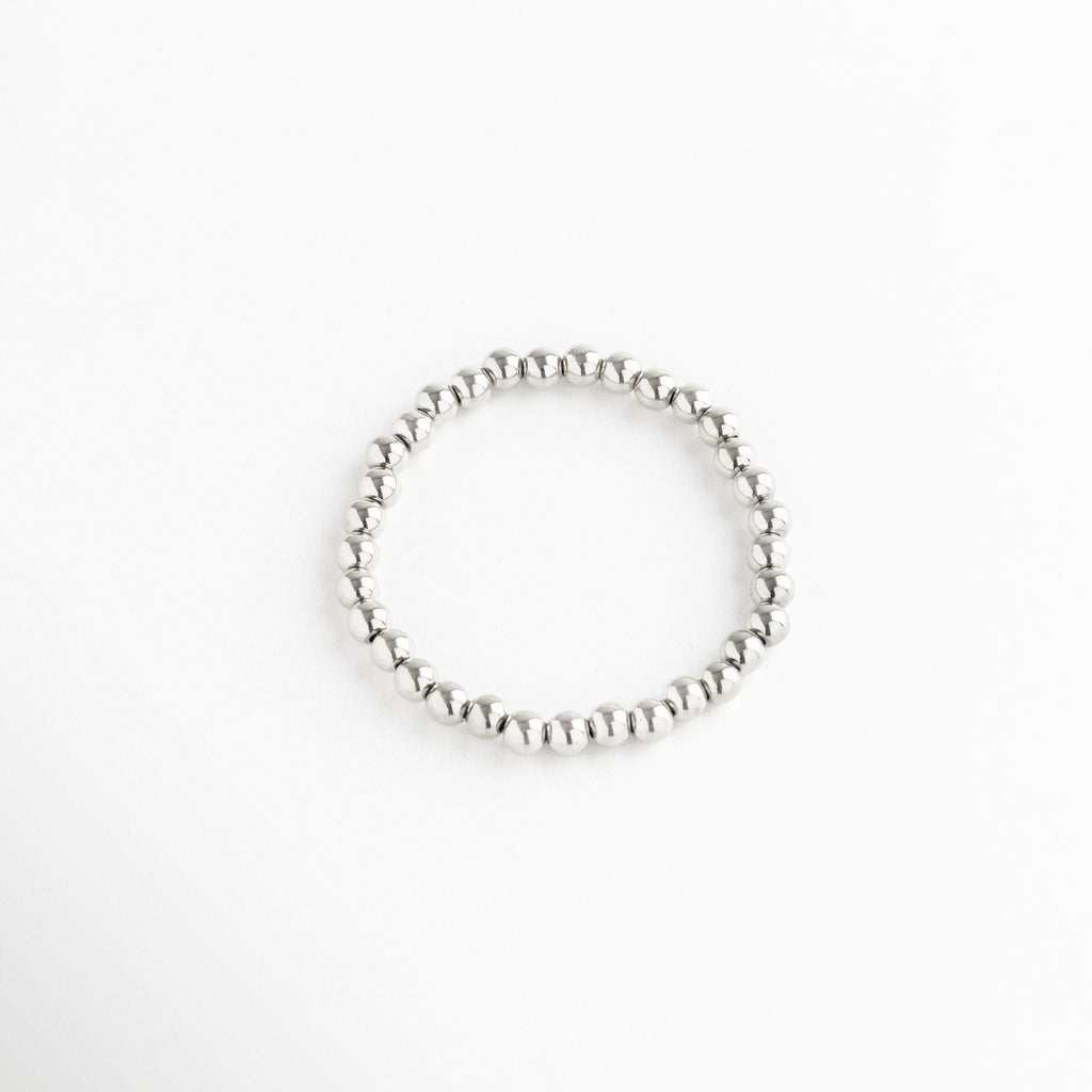 Pulsera de cuentas plateadas grandes, diseño elástico con estilo sofisticado, Pulsera plateada minimalista de esferas grandes, accesorio elegante y llamativo.