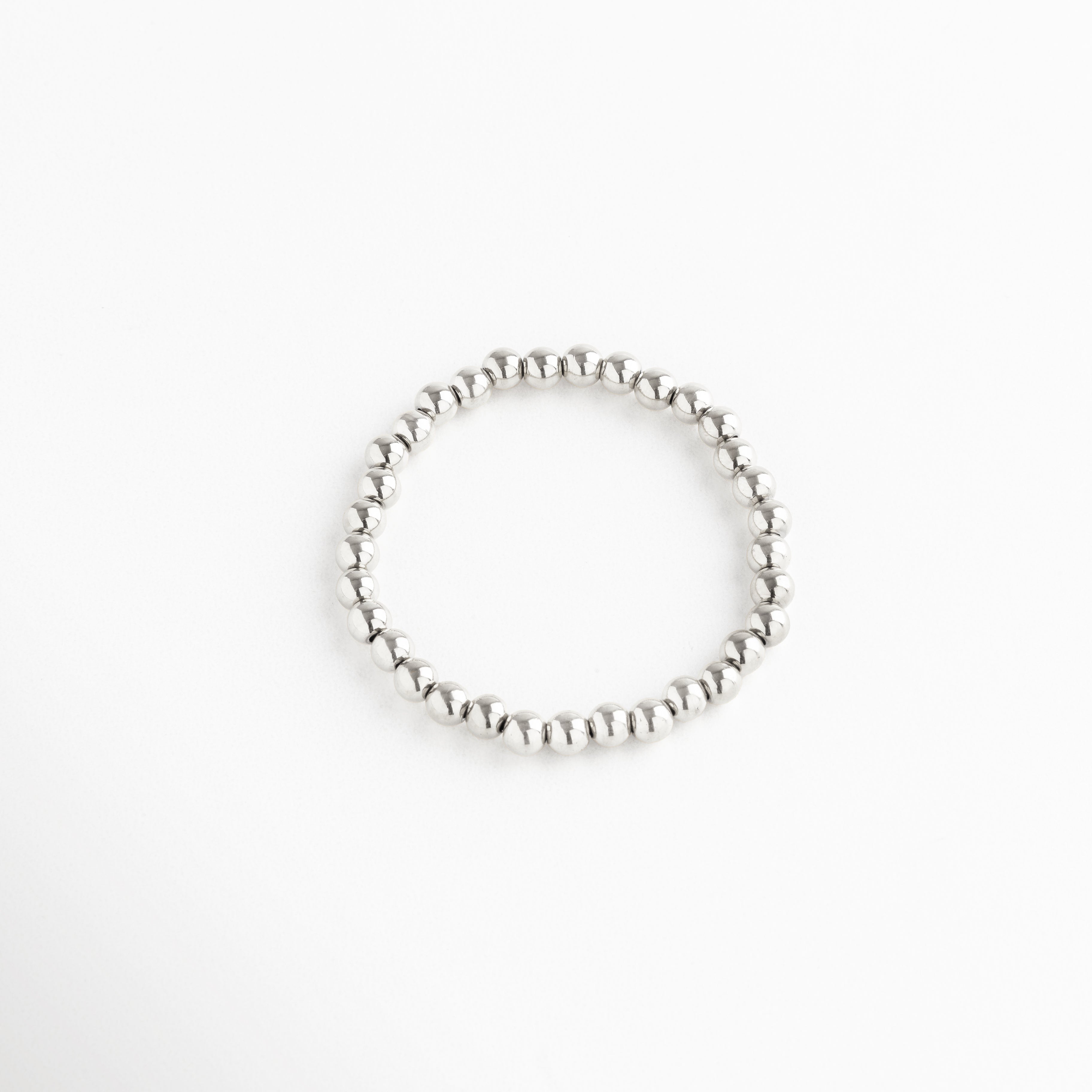 Pulsera de cuentas plateadas grandes, diseño elástico con estilo sofisticado, Pulsera plateada minimalista de esferas grandes, accesorio elegante y llamativo.