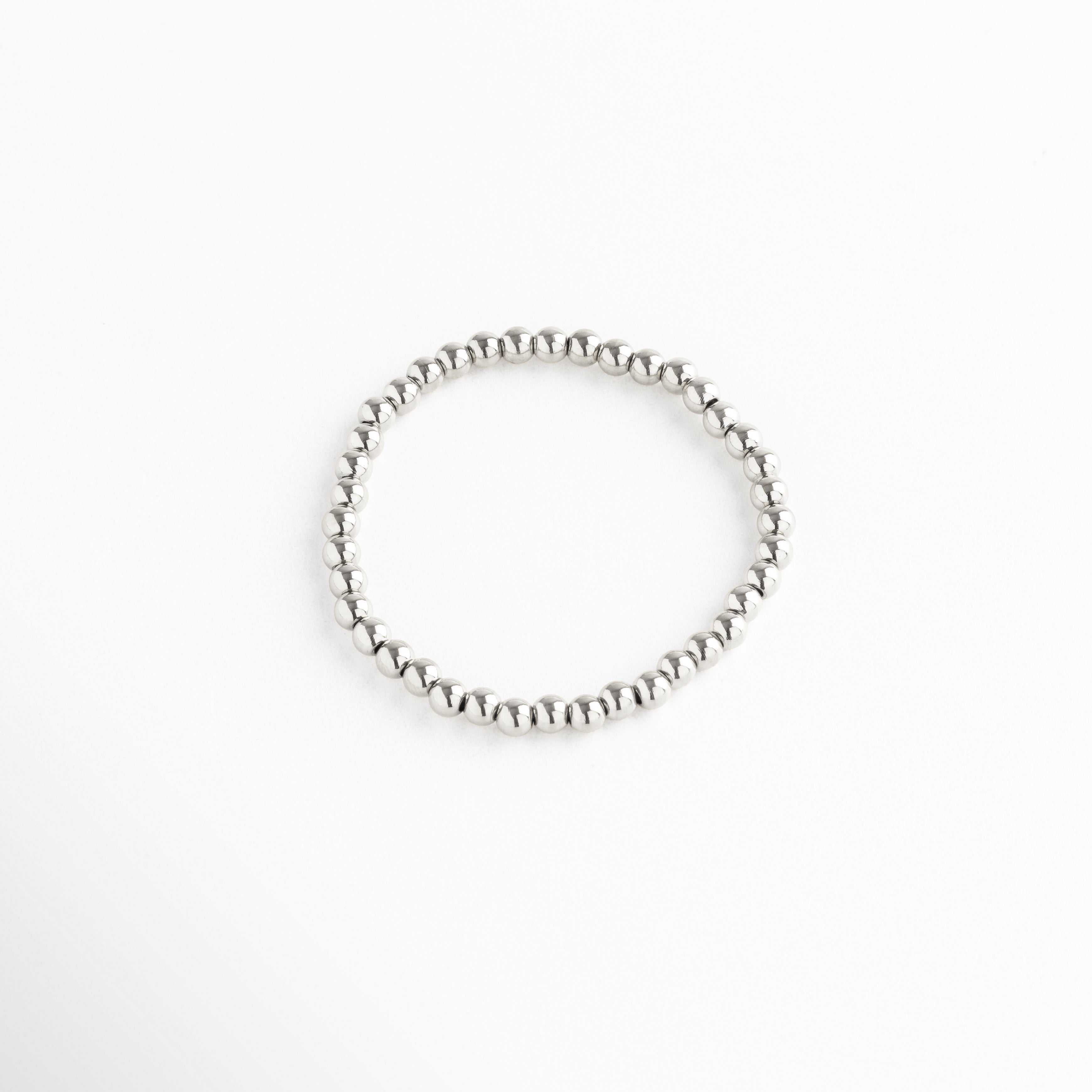 pulsera de cuentas plateadas medianas, diseño elástico y elegante, Pulsera plateada minimalista con esferas medianas, estilo moderno y versátil.
