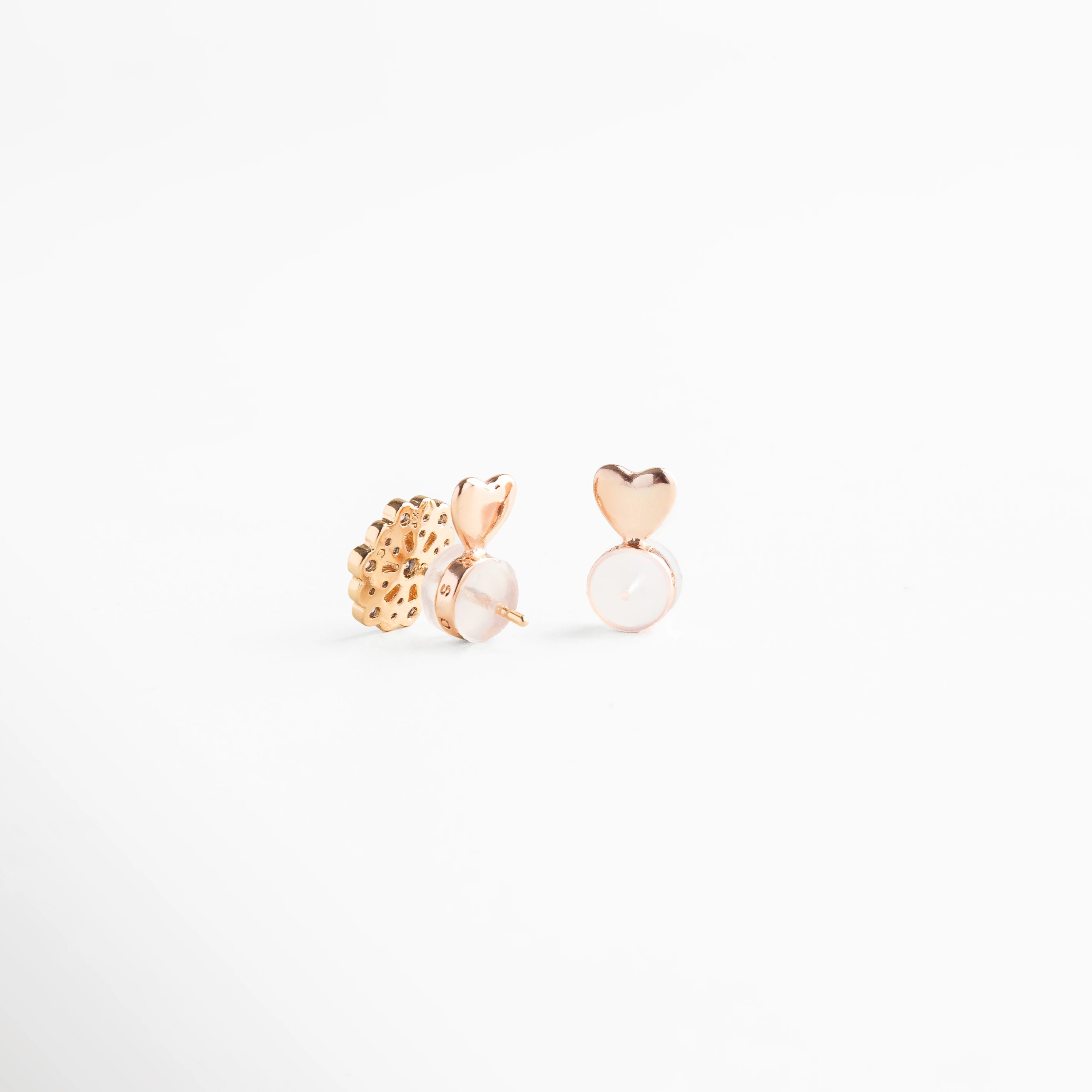 Gomitas en tono oro rosa para levantar la oreja, accesorio moderno y funcional con acabado brillante, ideal para dar soporte al lóbulo y realzar la posición de los aretes con un toque femenino