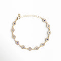 Pulsera dorada con diseño de ojo turco y zirconias, estilo elegante y amuleto de protección, Pulsera Code Ojitos en chapa de oro 18K con zirconias, diseño místico y sofisticado, Pulsera dorada con múltiples ojos turcos y brillo de zirconias, accesorio elegante de protección, Pulsera fina de 18 cm con detalles de ojo turco y acabado en oro 18K, Joyería dorada tipo pulsera con ojos turcos y zirconias brillantes, estilo moderno y espiritual