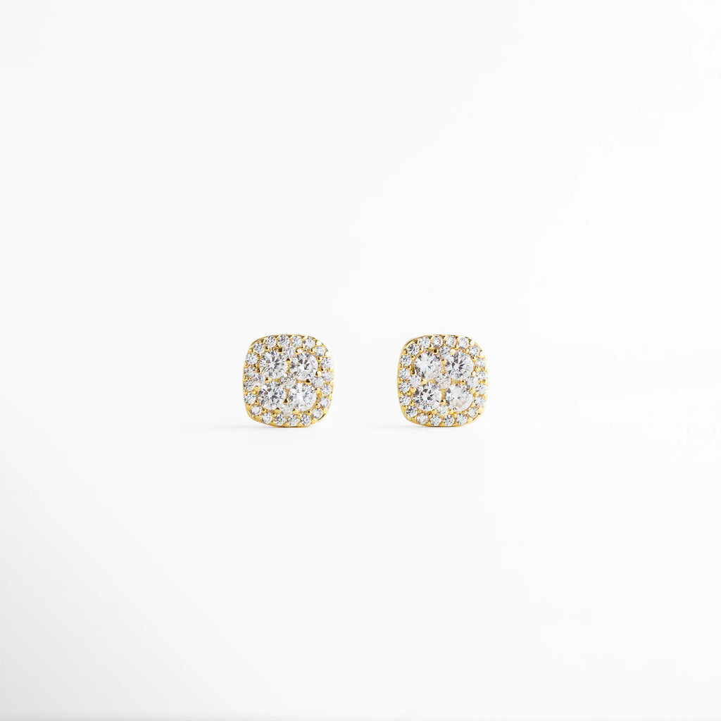 aretes dorados con zirconias brillantes, aretes stud dorados elegantes, aretes pequeños dorados con brillo sutil, joyería dorada minimalista femenina, aretes clásicos dorados para uso diario, aretes finos dorados con zirconias