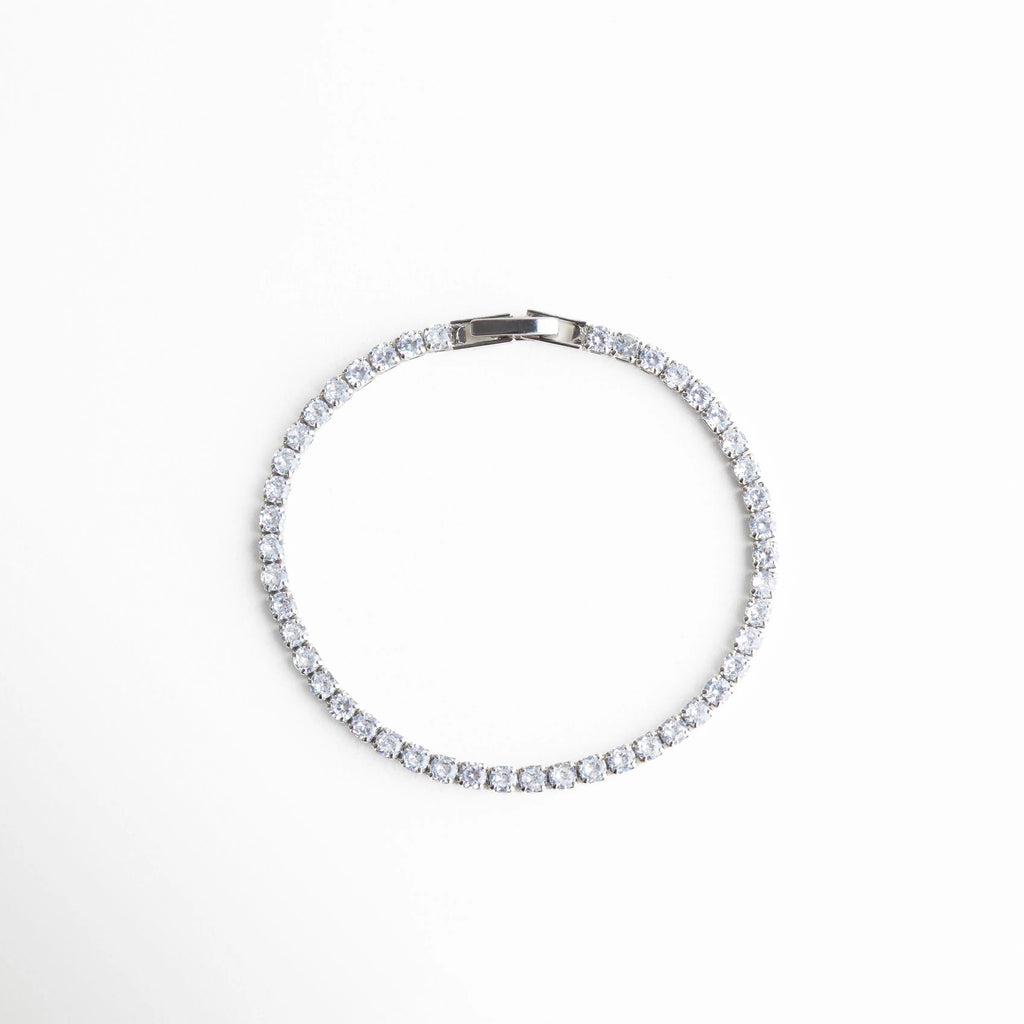 pulsera tennis circular, joyería plateada minimal, pulsera elegante mujer, accesorios plateados clásicos, pulsera chic diaria, joyería sofisticada, pulsera fina plateada, pulsera atemporal